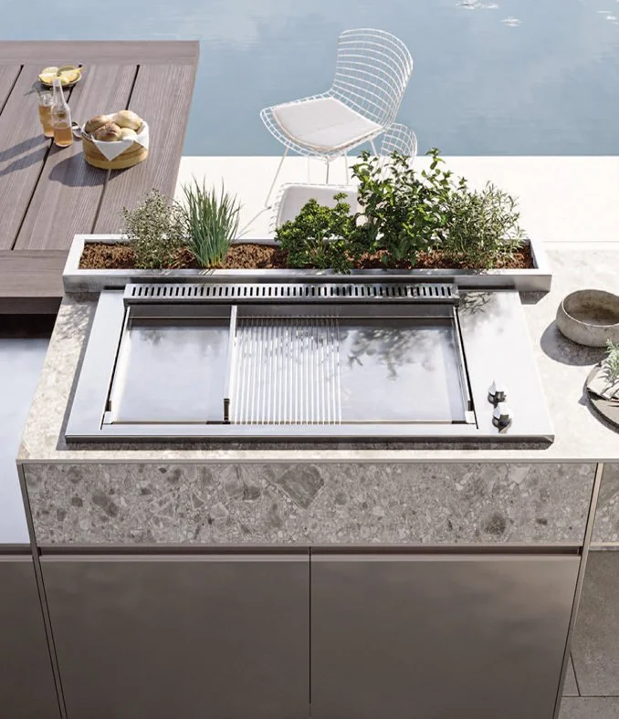 Arredo3 Aura outdoor kitchen featuring a recessed Ilve HBBQ100 stainless steel barbecue, supplied by Abitalia South Coast in Dorset, Hampshire, and Surrey.