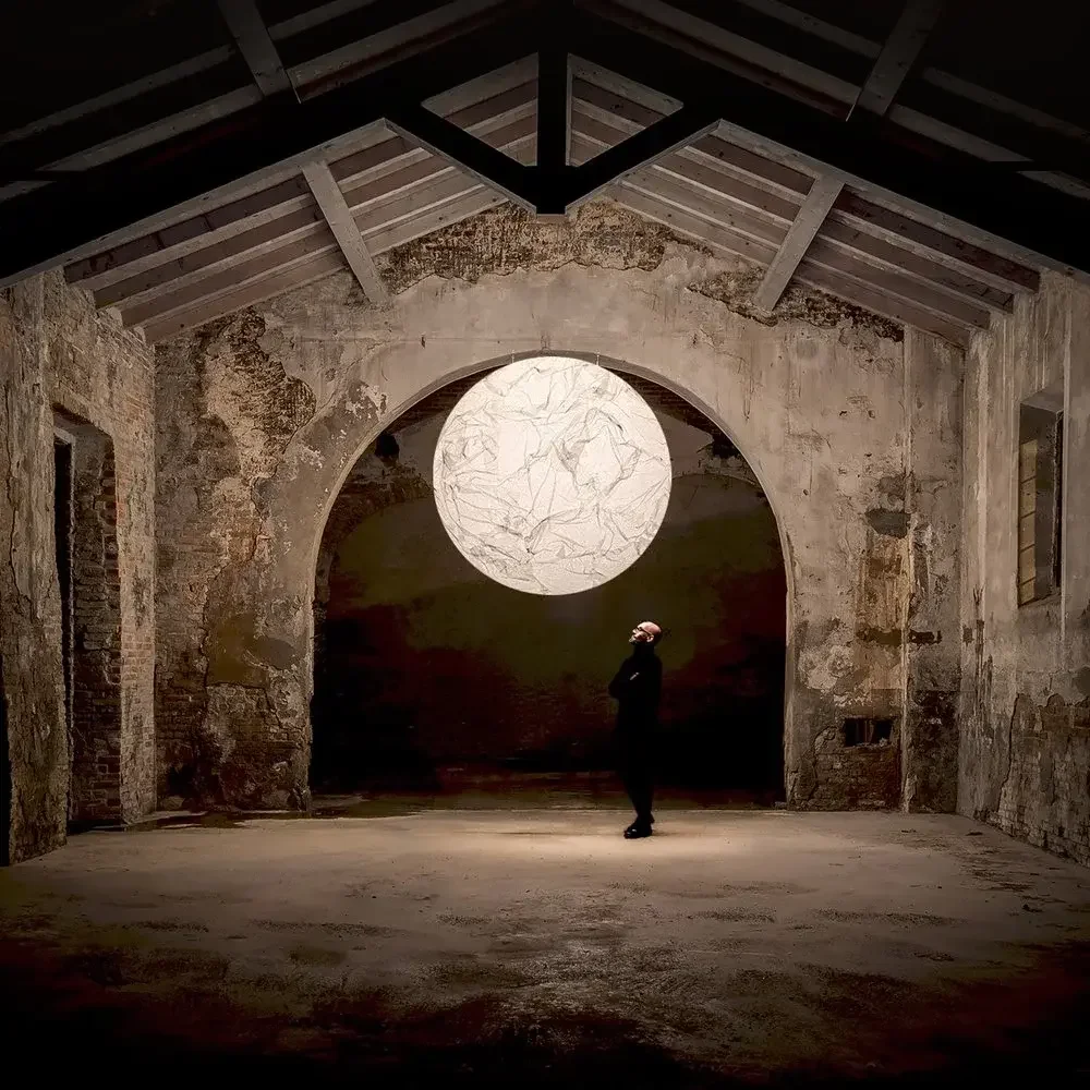 Moon 120 pendant lamp by Davide Groppi, handmade Japanese paper with soft ambient glow in modern interior.