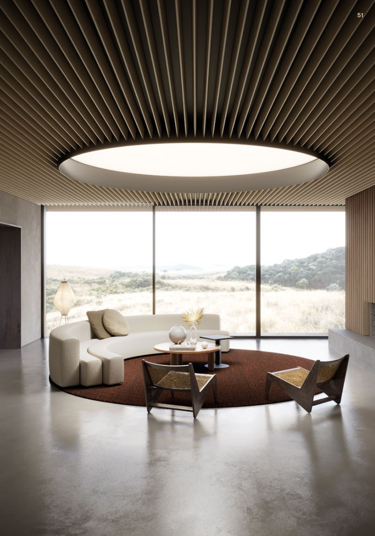 Contemporary office interior with architectural ceiling lighting feature.