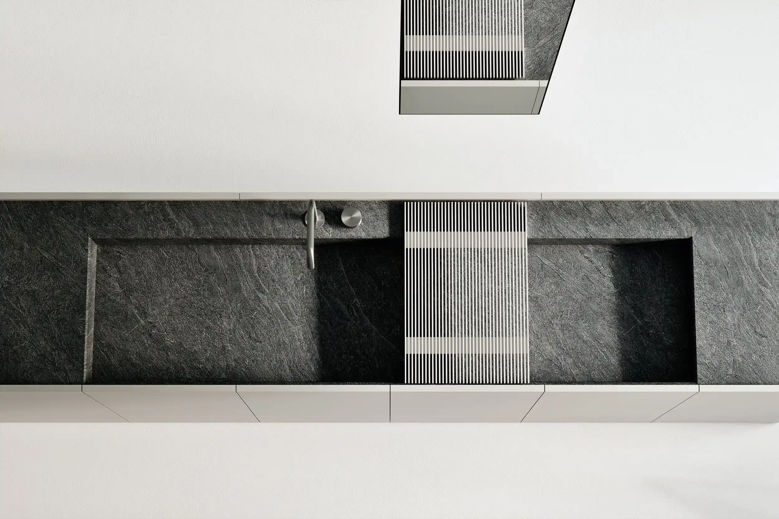 Makro porcelain washbasin with black porcelain basin, stainless steel drain, and white cabinets, designed by Abitalia South Coast in Dorset, Hampshire, and Surrey, UK.