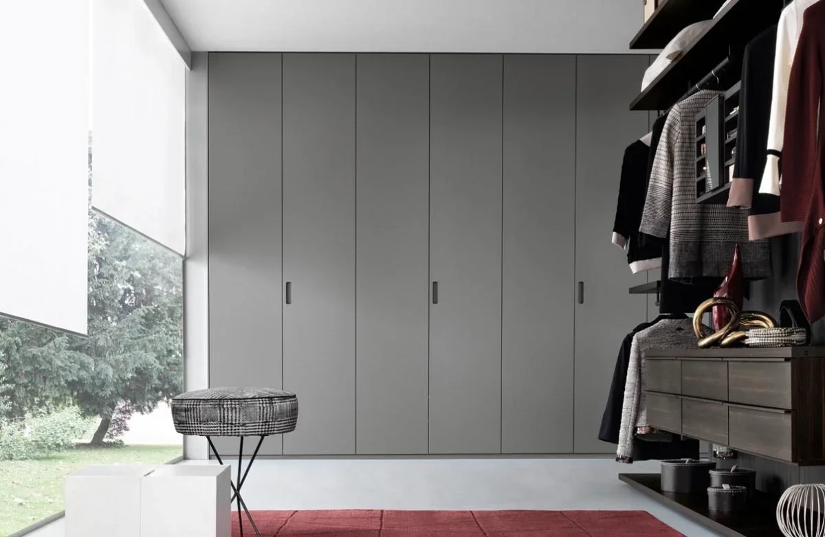 Coplanar Pacific wardrobe by Giellesse featuring flush sliding doors integrated seamlessly into the wall