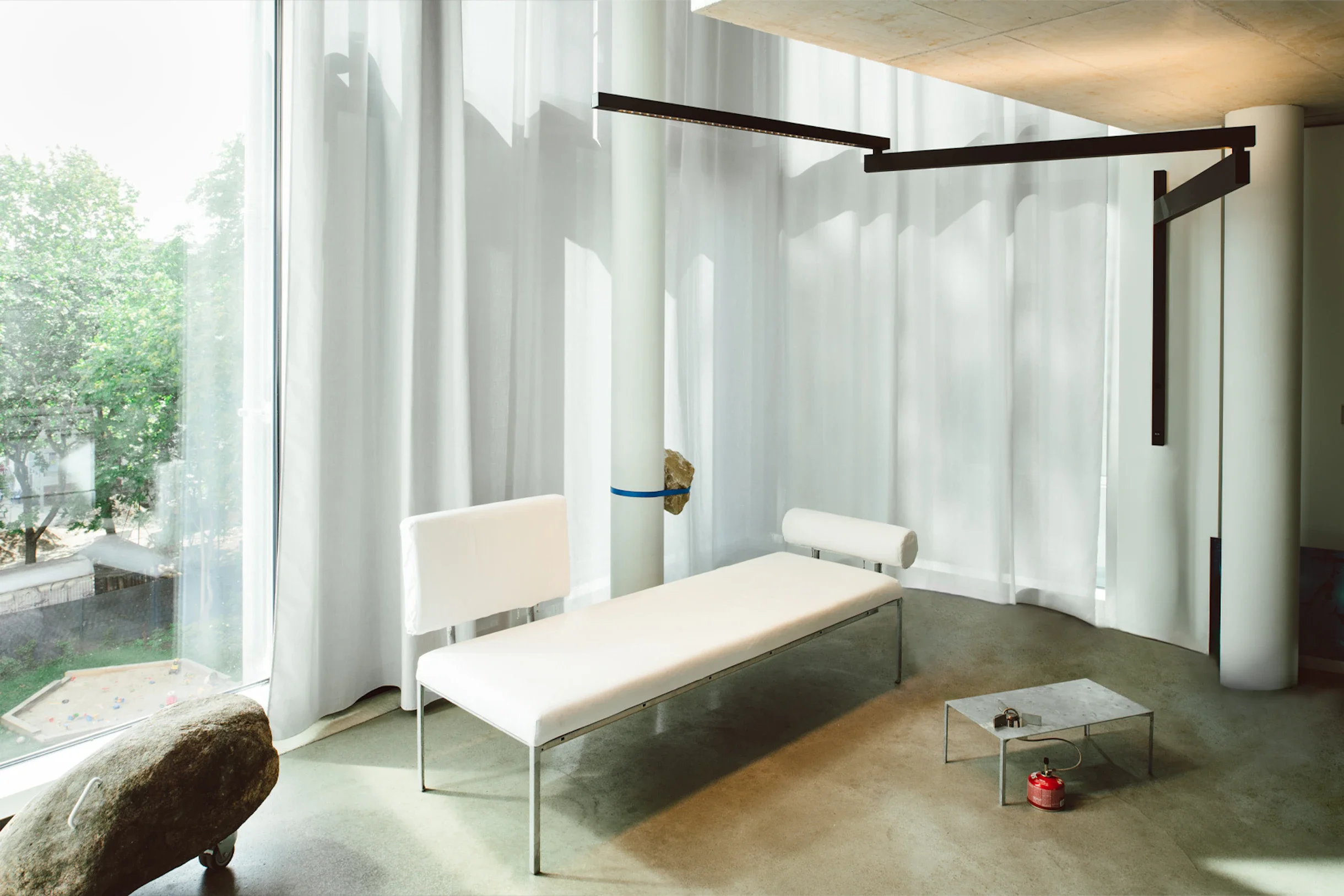 Industrial-style wall light designed by Konstantin Grcic for Flos with architectural presence.