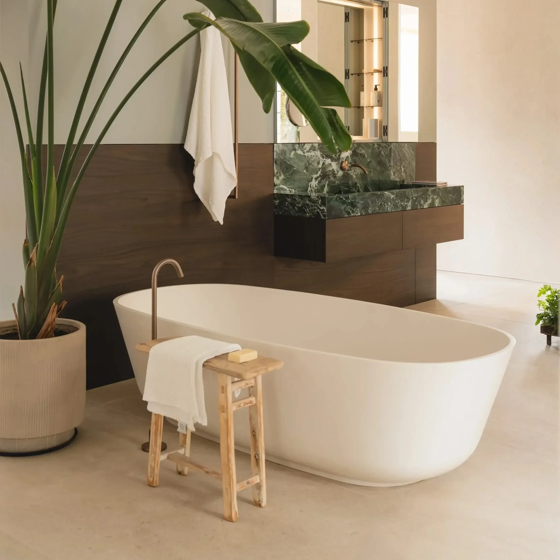 Baìa Bathtub by Antoniolupi in Cristalplant with minimalist oval design and customizable lacquer finish in modern bathroom.