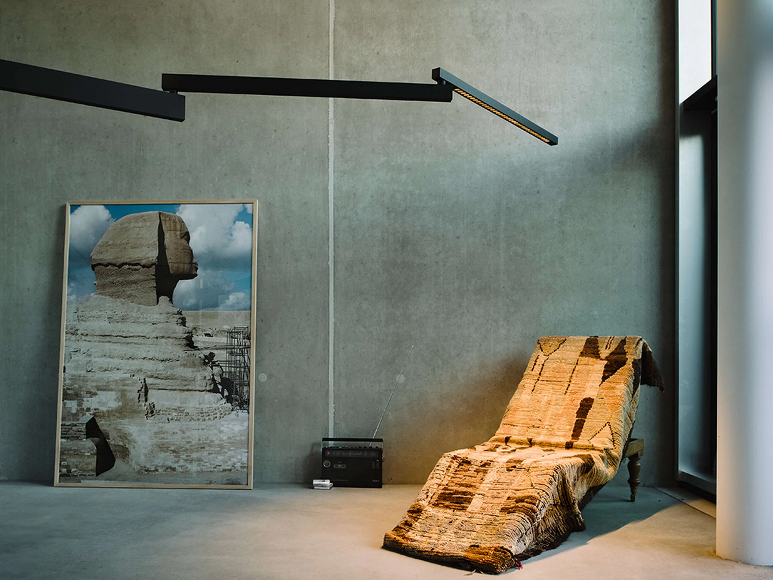 Industrial-style wall light designed by Konstantin Grcic for Flos with architectural presence.
