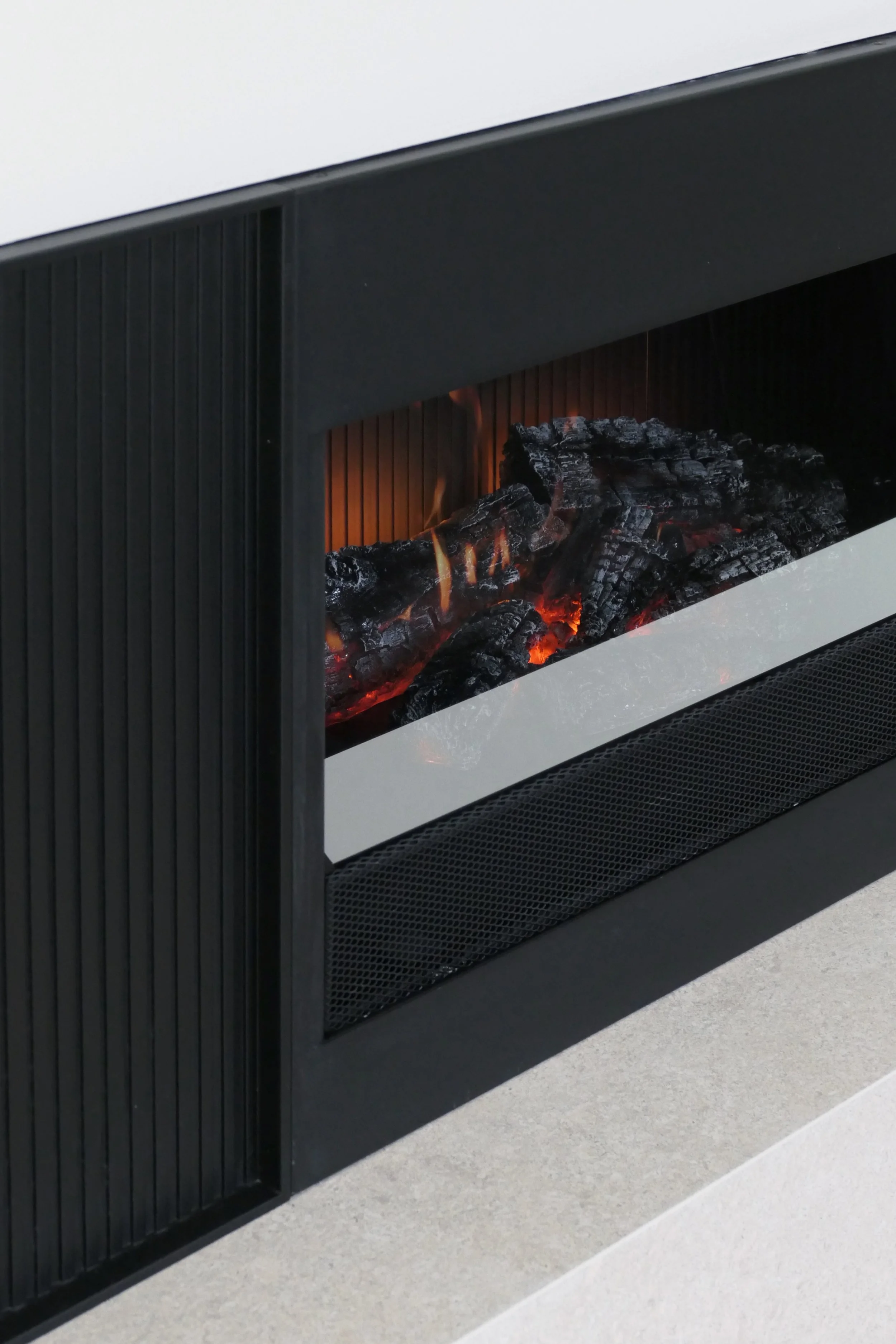 Luxury fireplace installed in a modern living room by Abitalia South Coast in Dorset.