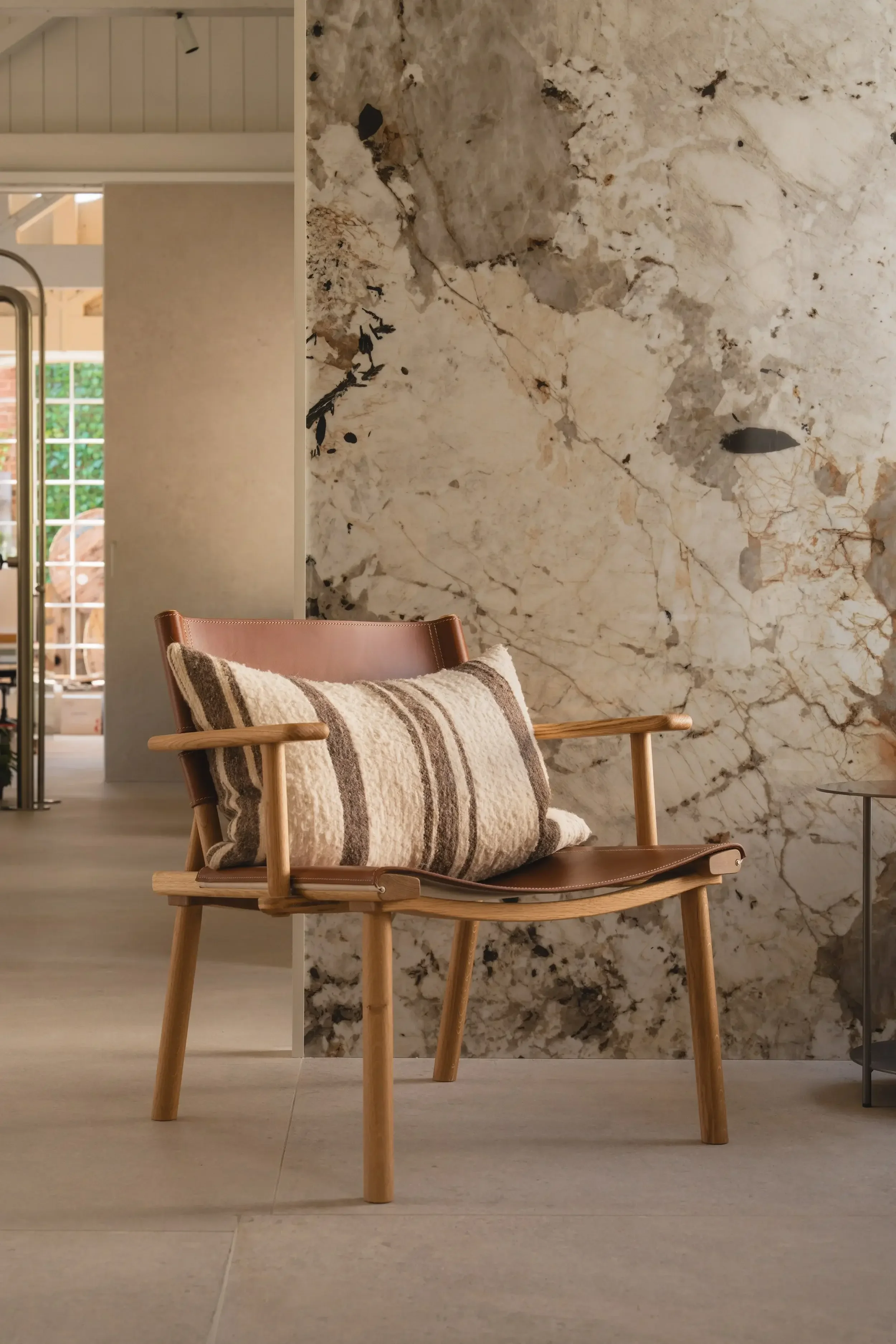 Lounge chair creating cozy and sophisticated atmosphere.