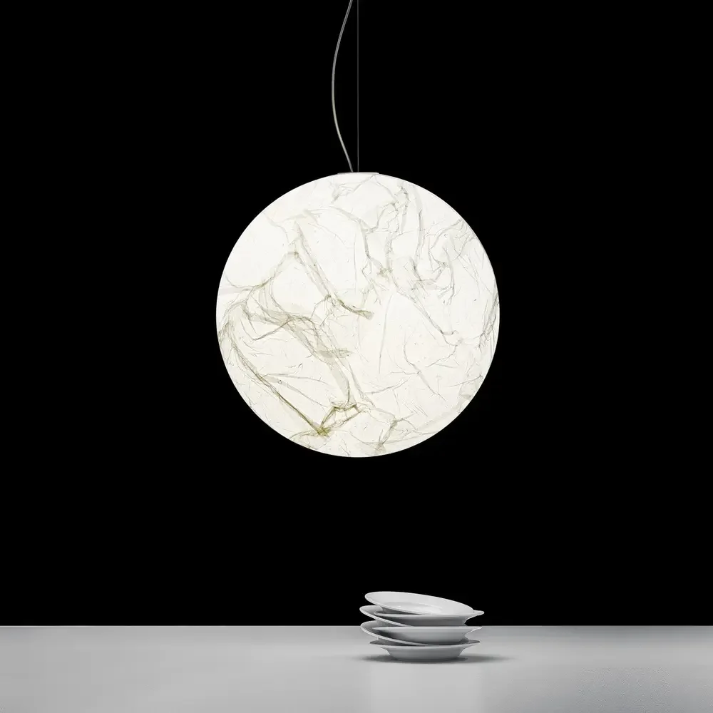 Pendant light by Davide Groppi as focal point, combining craftsmanship, elegance, and mood lighting.