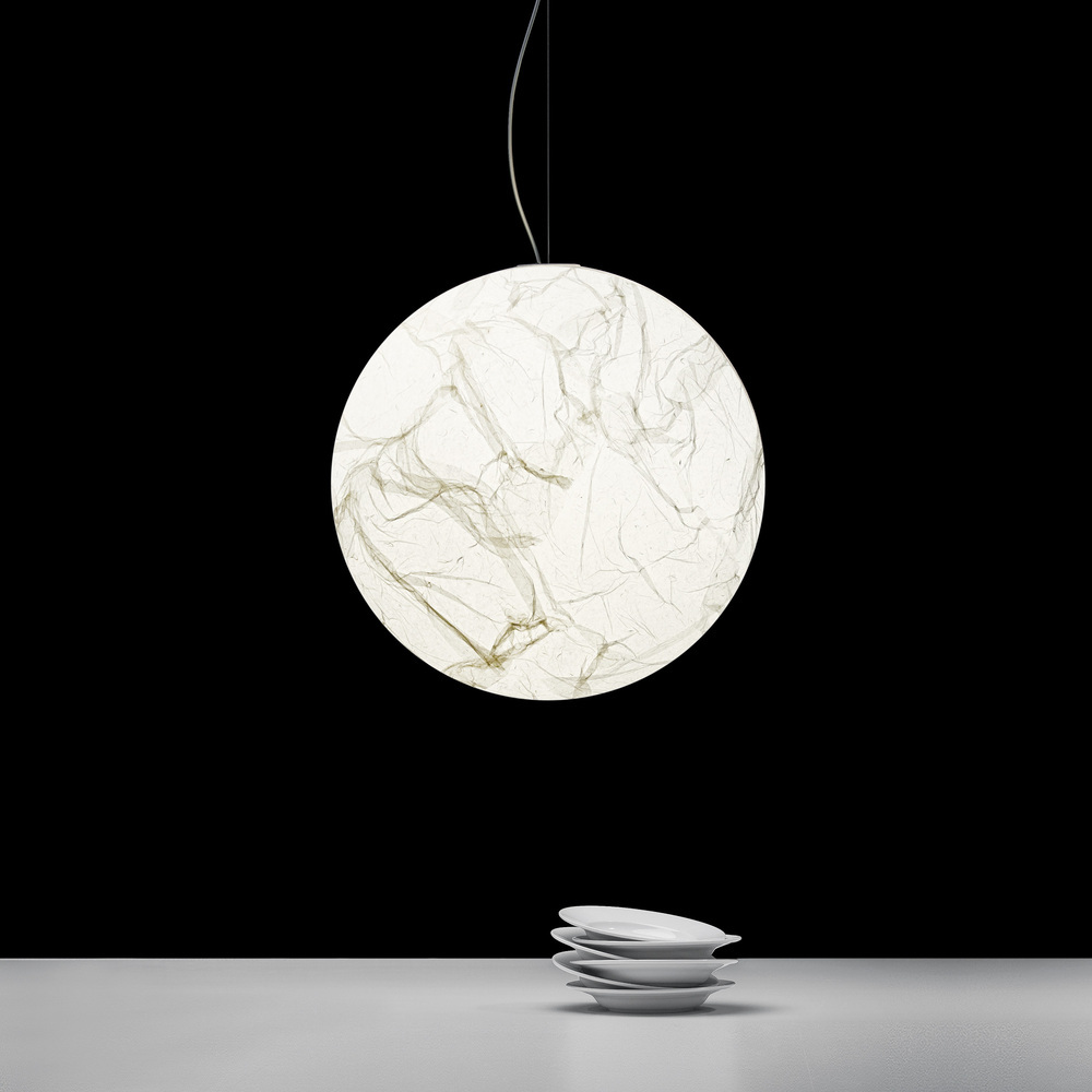 Pendant light by Davide Groppi as focal point, combining craftsmanship, elegance, and mood lighting.