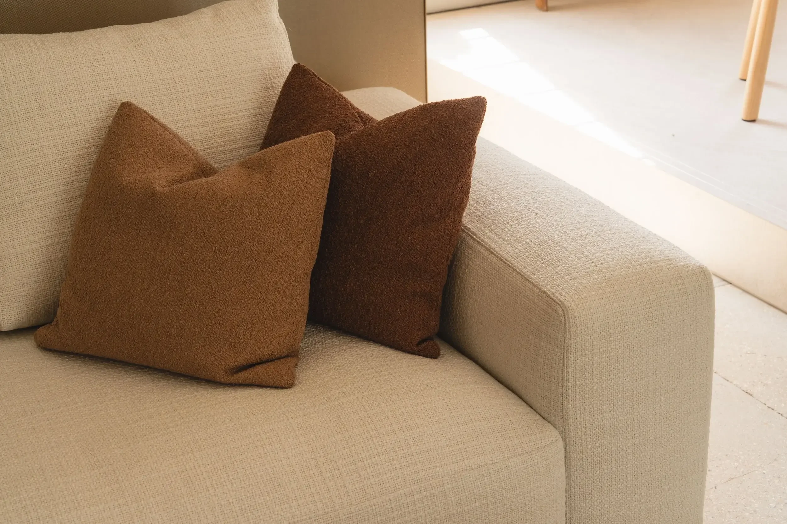 Luxury Italian designer sofa with clean lines and neutral upholstery, perfect for contemporary living rooms.