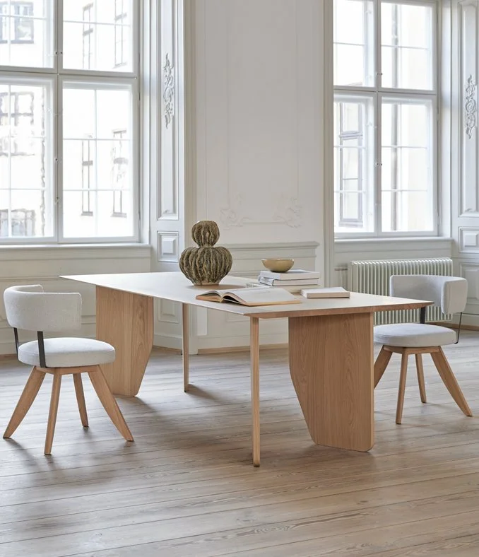 Modern minimalist dining room with More Moebel table and chairs, designed by Abitalia South Coast in Dorset, Hampshire, Surrey, UK.