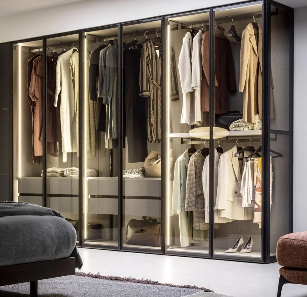 Designer wardrobe as focal point in curated modern interiors.