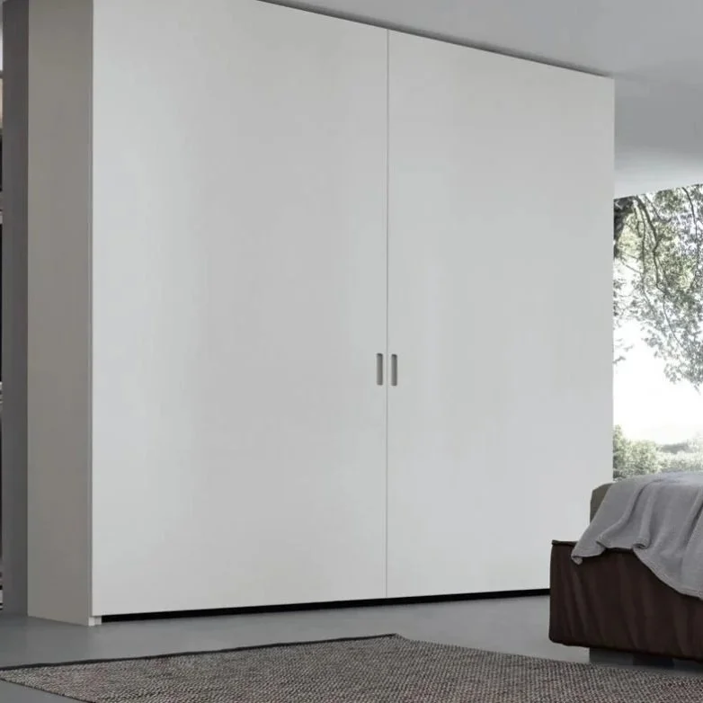 Coplanar Pacific Wardrobe by Giellesse with minimalist sliding doors in modern bedroom.