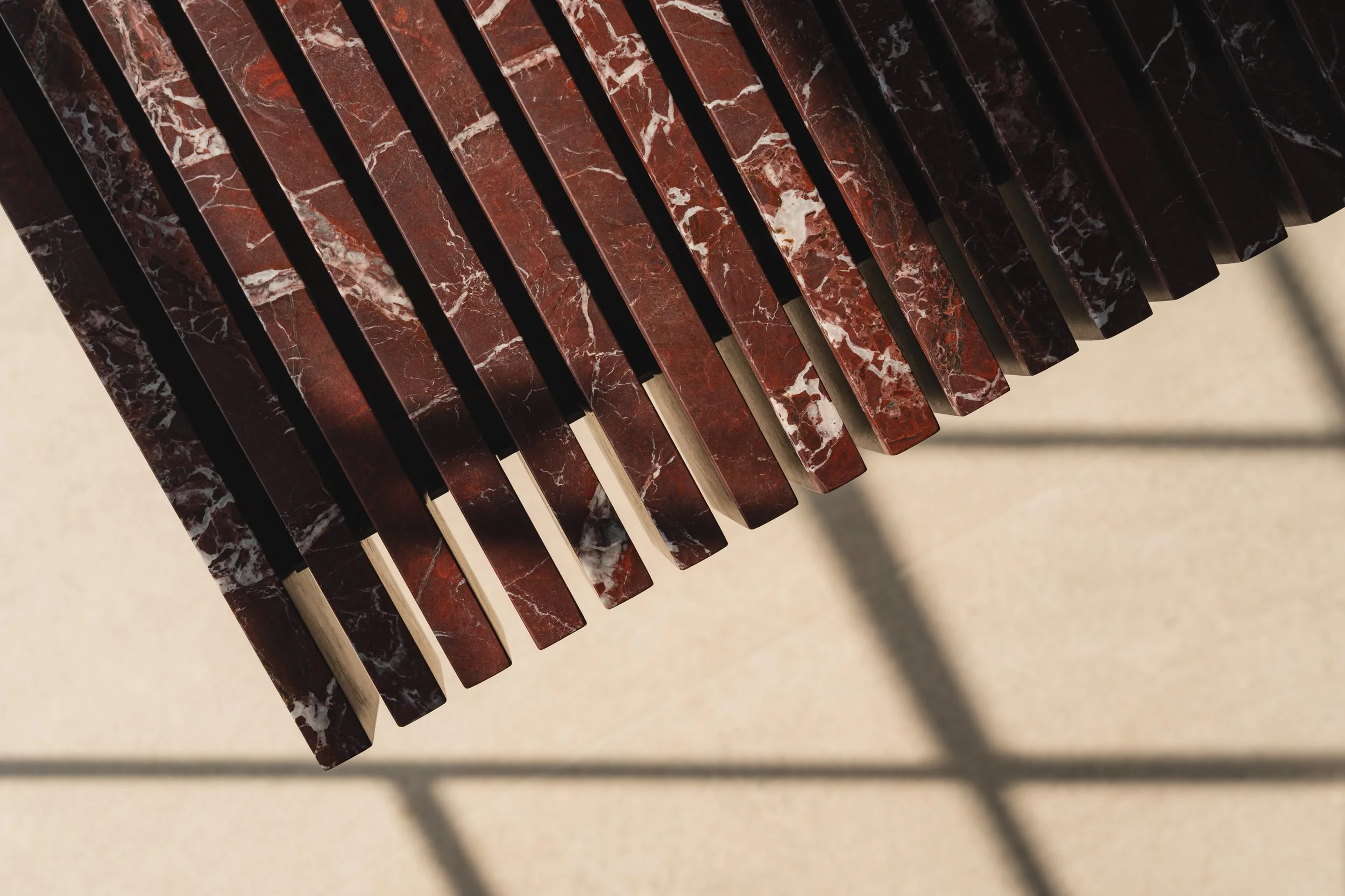 Close-up of marble veining on Serafini’s floating Piano sink.