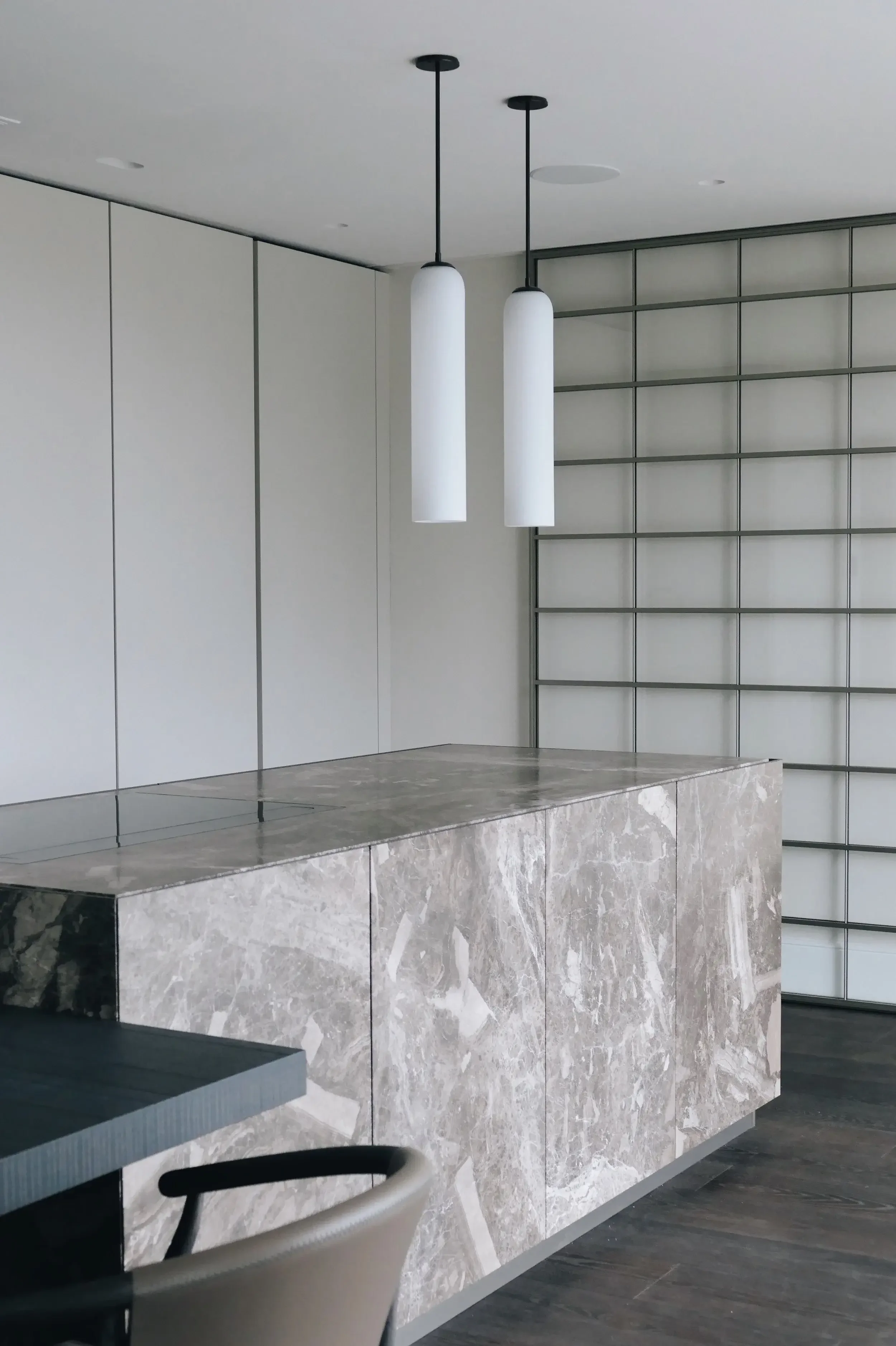 Luxury Zampieri Segni kitchen designed with rare Antolini marble and Rimadesio Storage unit, capturing the essence of the Jurassic Coast