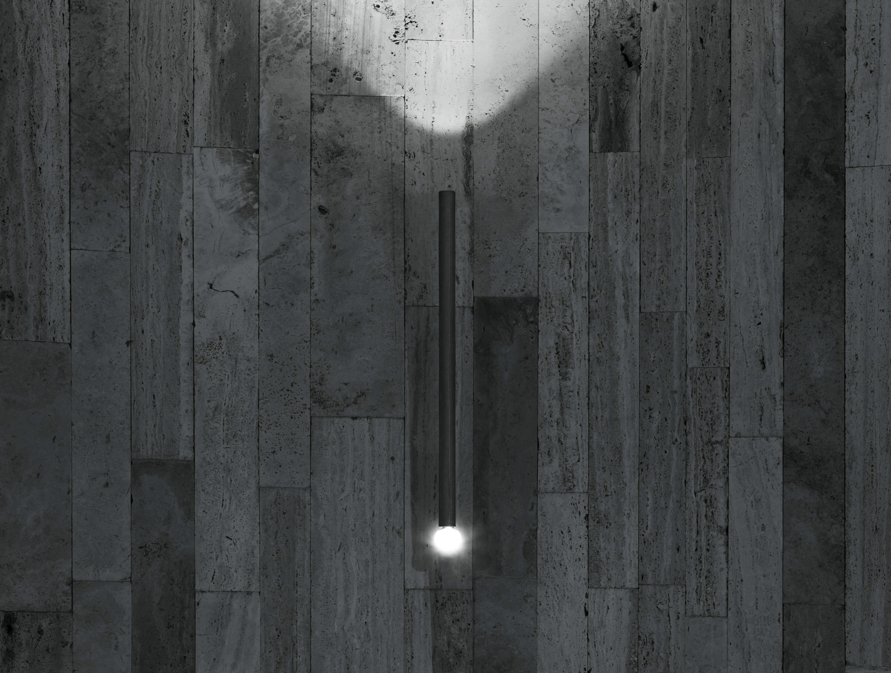 Flos outdoor wall light casting soft, ambient illumination on a terrace.