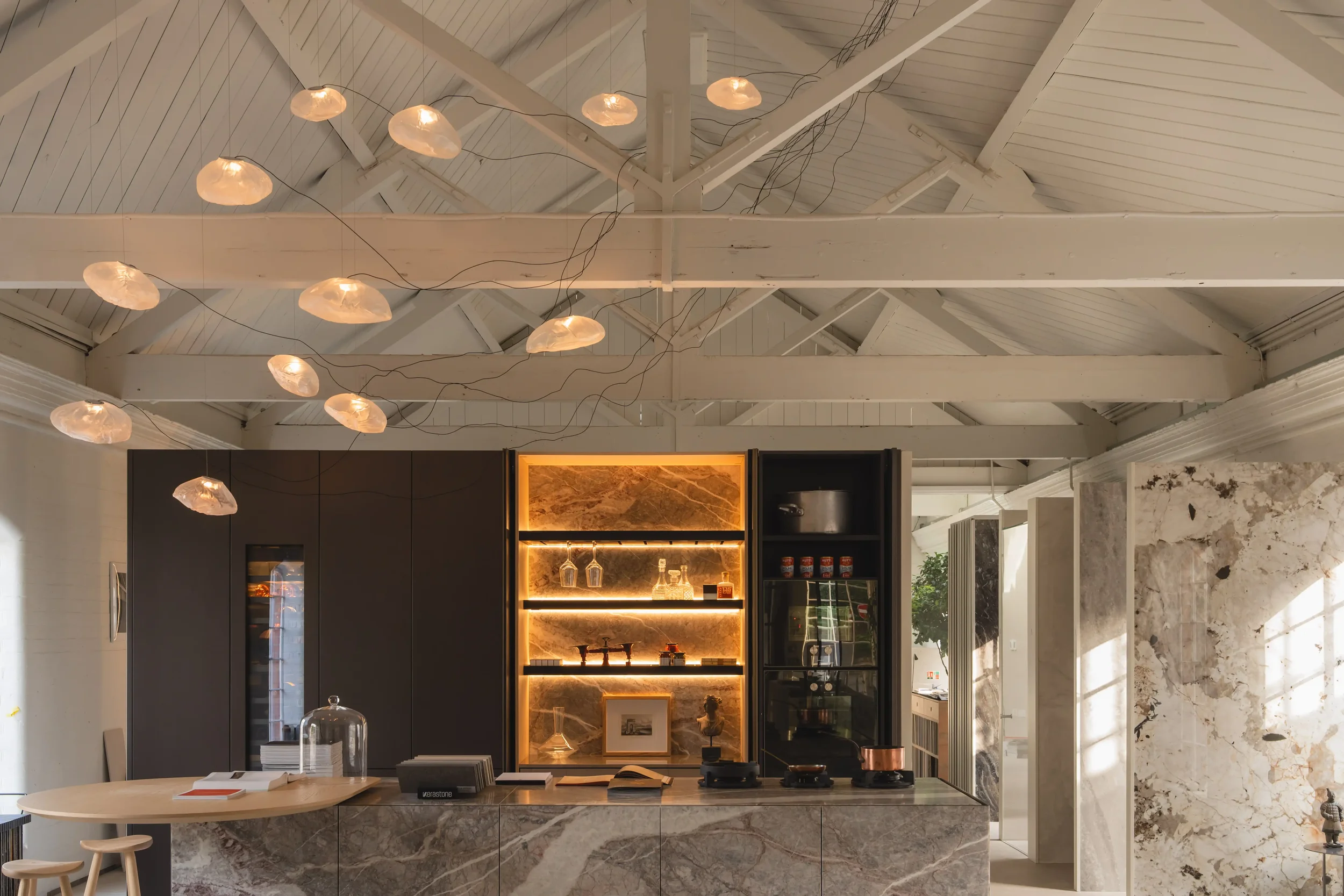 Pendant light illuminating a modern space, emphasizing the delicate interplay of light and shadow.