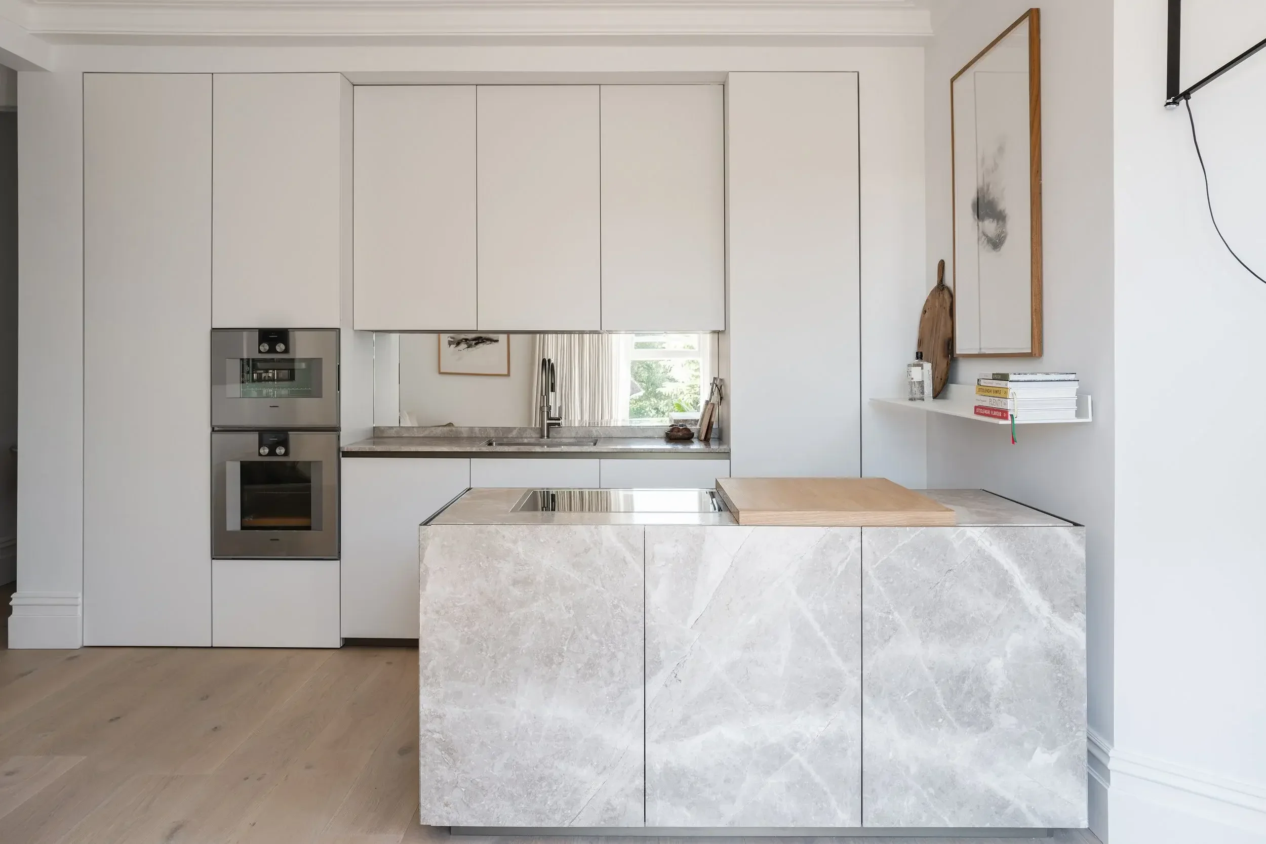 Luxury contemporary kitchen in Dorset with porcelain finish and integrated gagenau appliances.