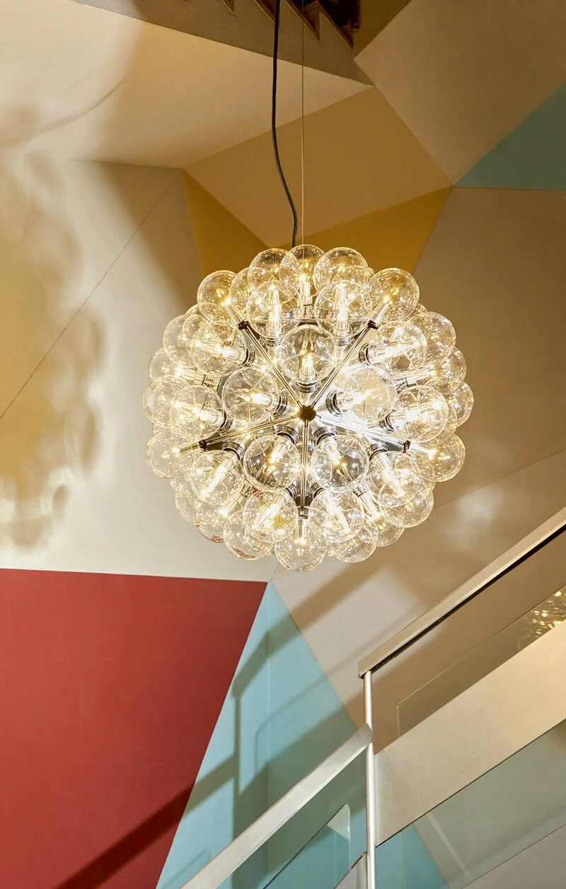 The Taraxacum 88 chandelier, revealing its balanced geometry and airy composition designed to float within the space.