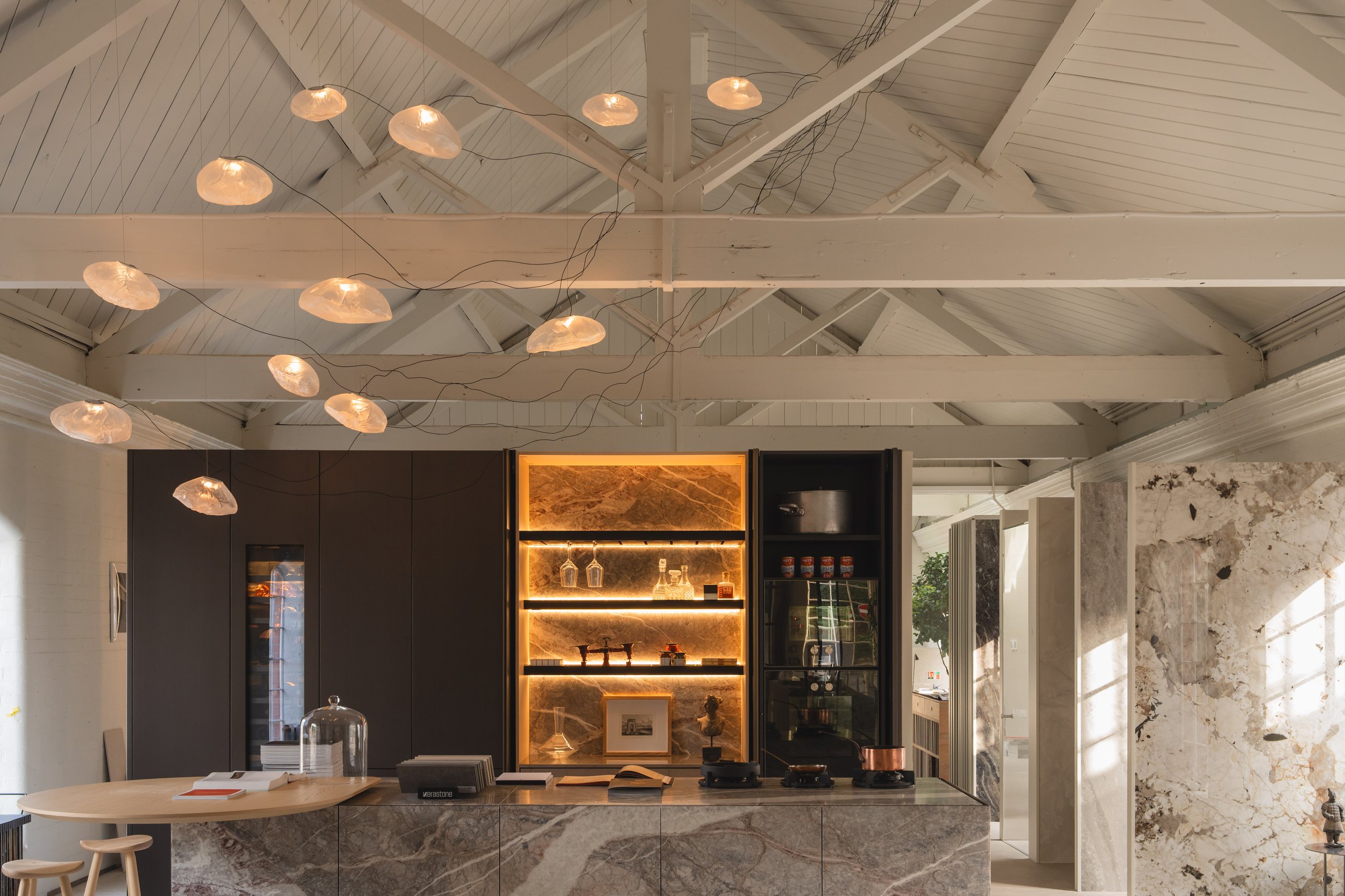 Pendant light illuminating a modern space, emphasizing the delicate interplay of light and shadow.