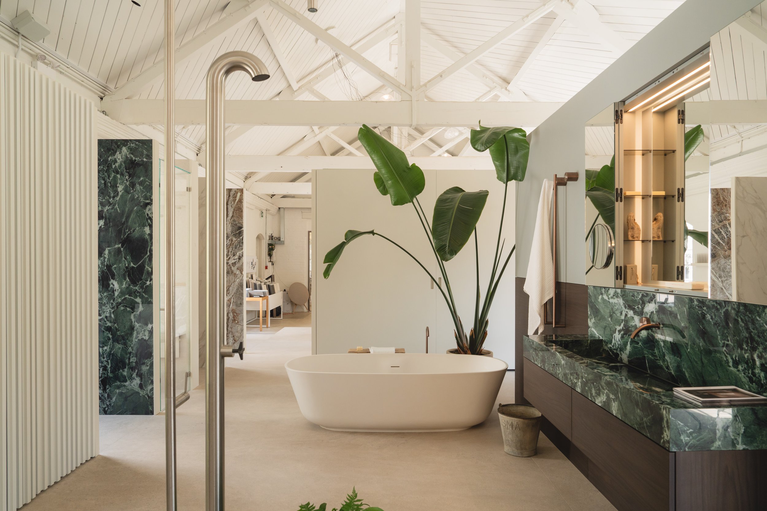 Baìa lacquered externally in a bold color, integrating seamlessly into a modern bathroom interior.