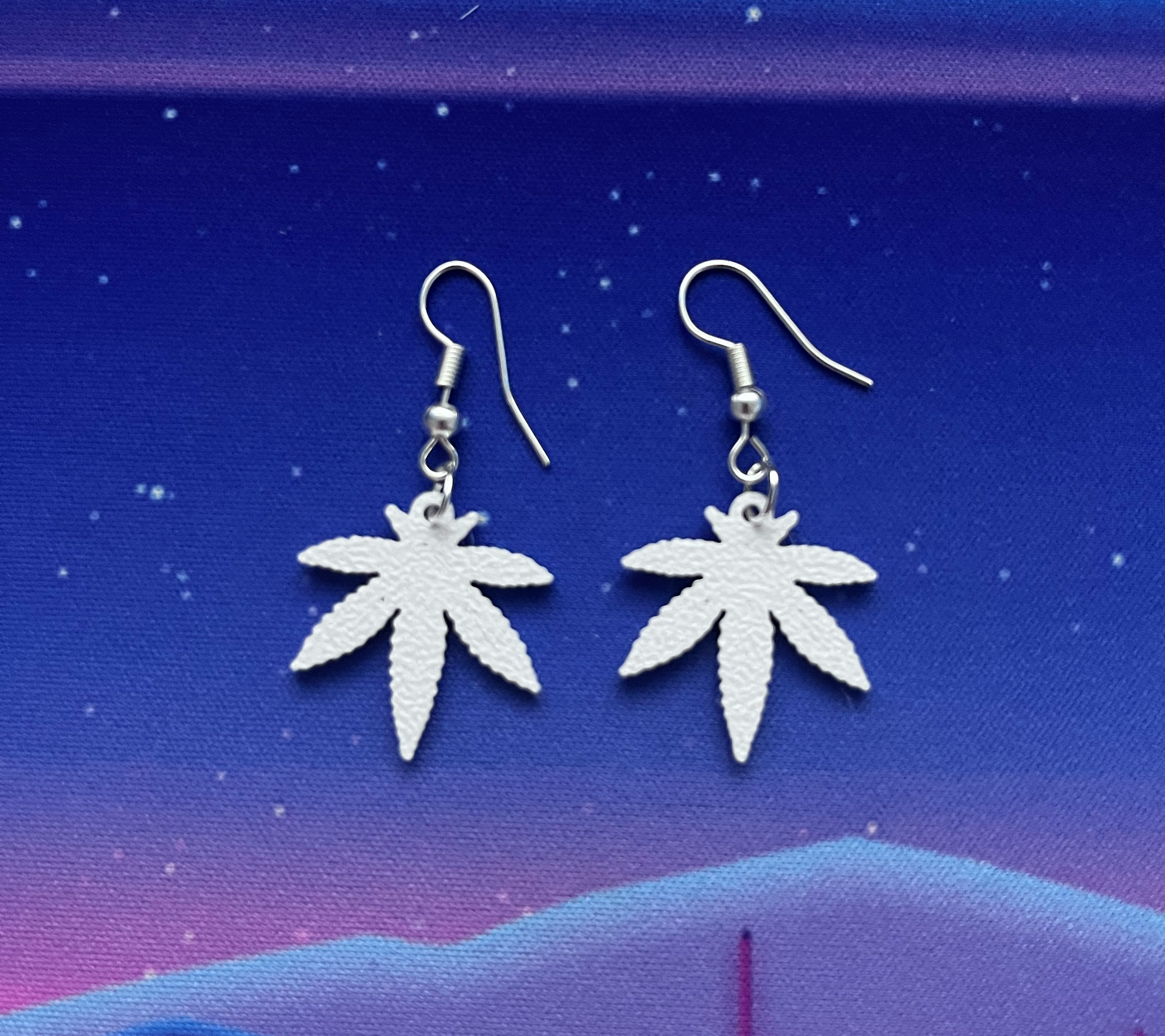 SMALL WHT HEMP LEAF SILVER EARRINGS.png