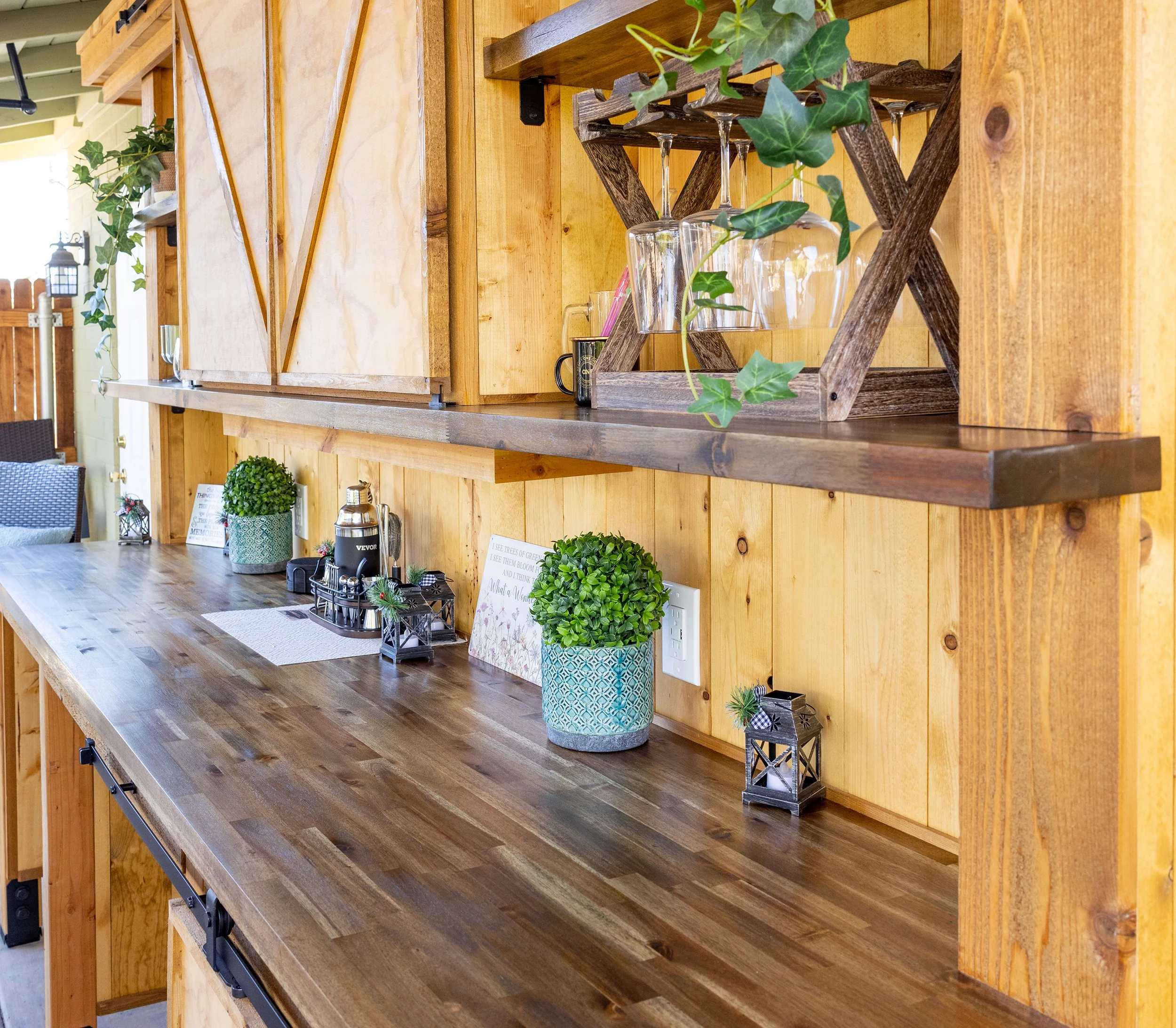 Finish carpentry details truly make this outdoor bar exceptional.  November 2025