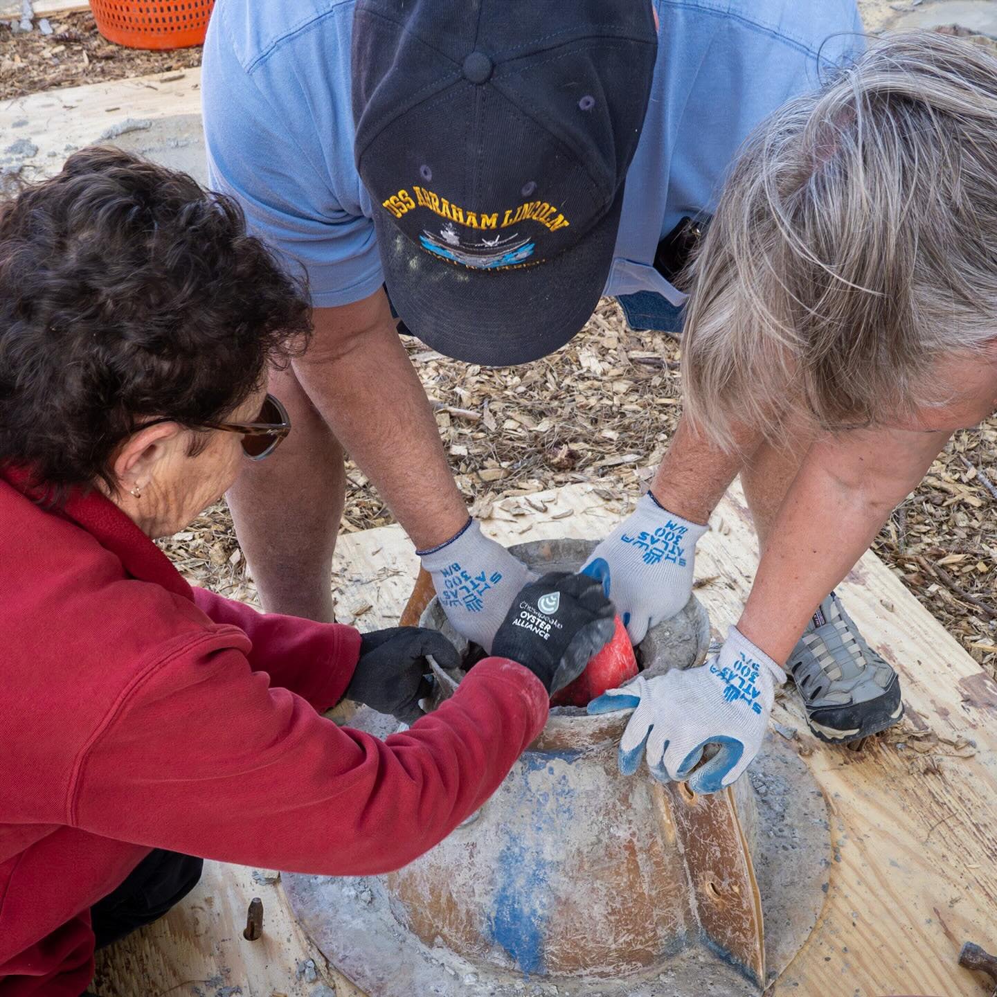 Yes, sometimes it takes 3 people to get the inflatable out of the concrete. Why is it there? It holds space in the reef ball so the concrete forms around it. Another 30+ built today for eventual placement in Newport News! 
*
*
*
#buildingreefballs #?