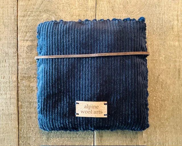 Back view of wool panel with navy cotton corduroy backing.