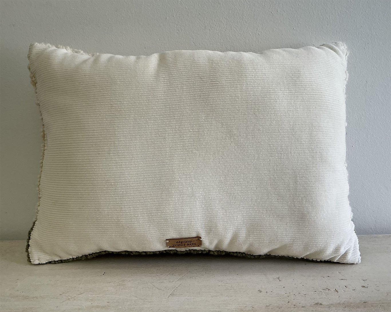 Back of pillow in ivory cotton corduroy.