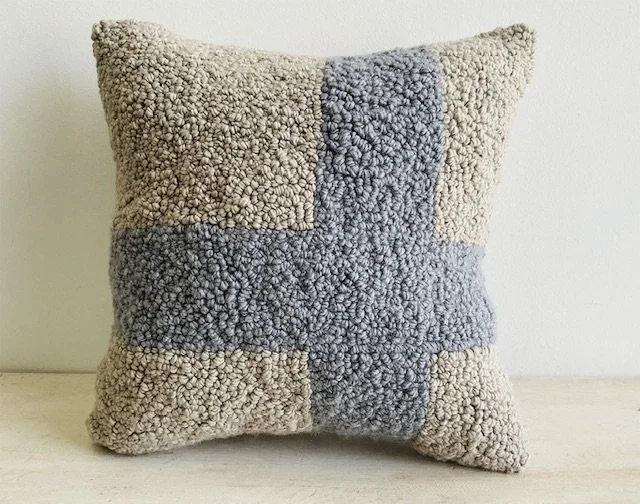 Hand-hooked natural wool pillow featuring gray blue geometric lines.