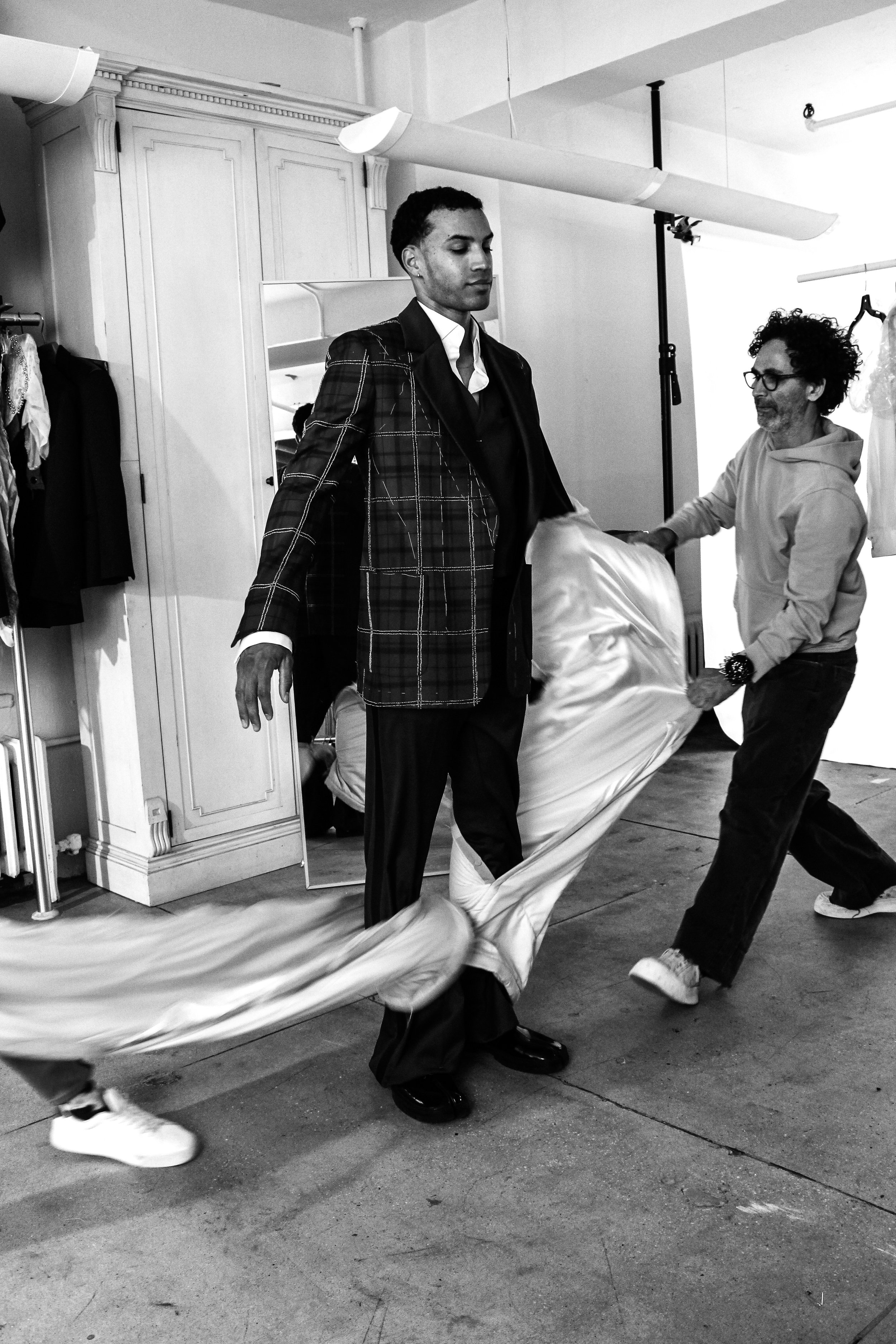 Tailored Roots
My father, Joel Diaz, learned patternmaking and tailoring from a young age, creating his first dress in his mother's dressmaking shop in the Dominican Republic at age 12. In the early '90s, he moved to New York City with nothing but t