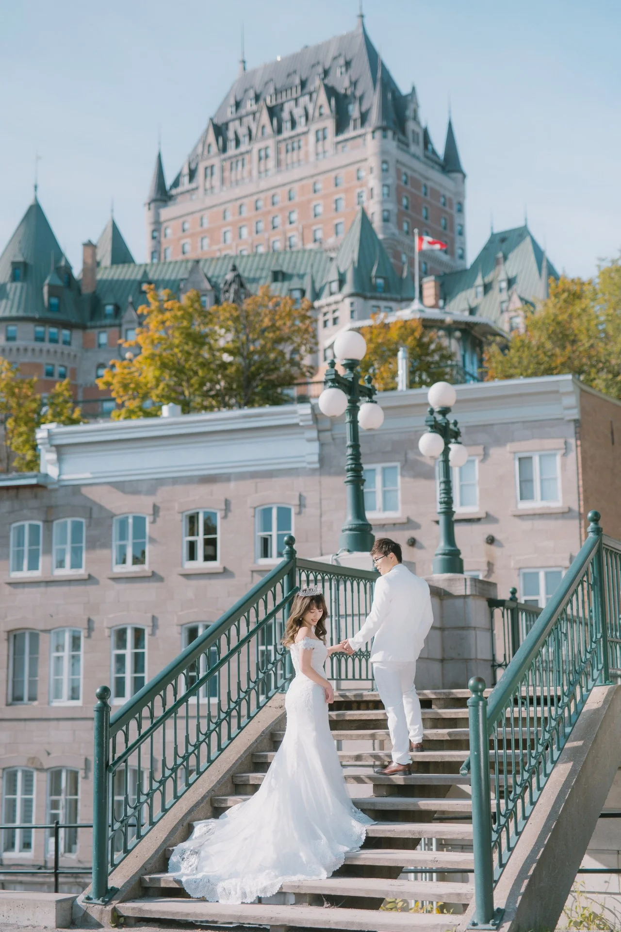 Couple posing on the outdoor staircase
