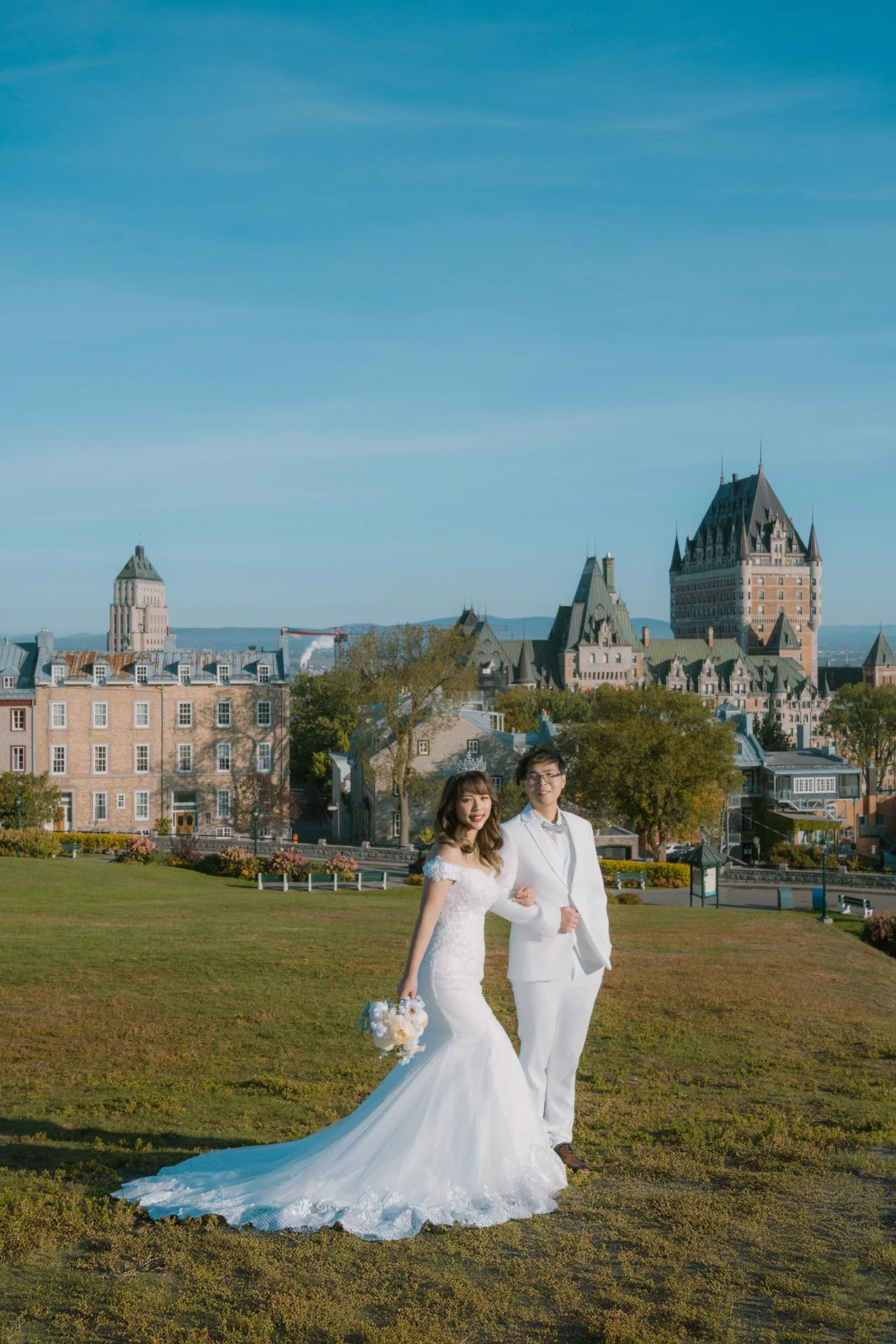 Couple on grass with city view