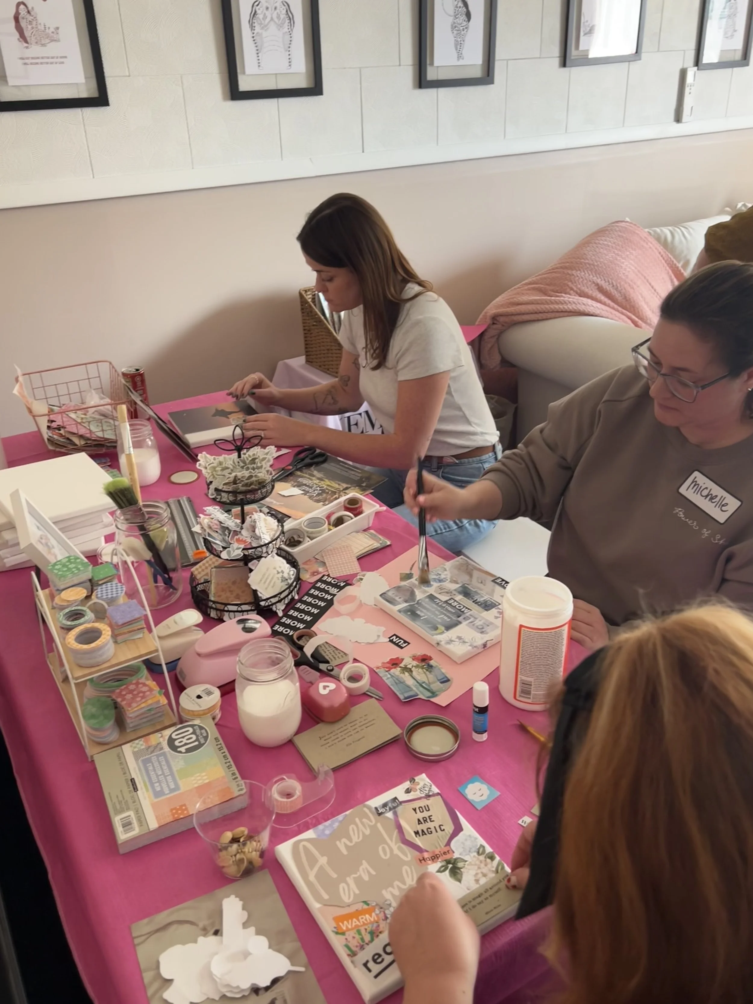 women sitting at an art station at a women's retreat for healing body image