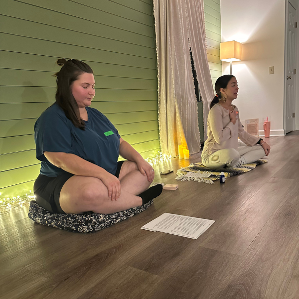 jess fry therapist sitting in relaxed position during in person mindfulness event