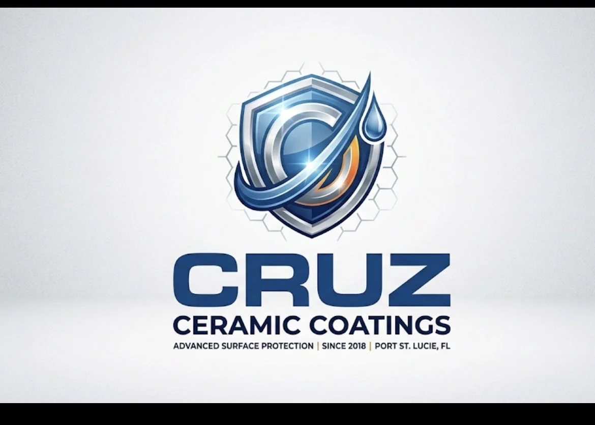 A logo for Cruz Ceramic Coatings features a shield with a stylized blue water droplet, swirl, and honeycomb pattern in the background. Text below reads 'CRUZ CERAMIC COATINGS' with additional information about advanced surface protection, since 2018, located in Port St. Lucie, Florida.