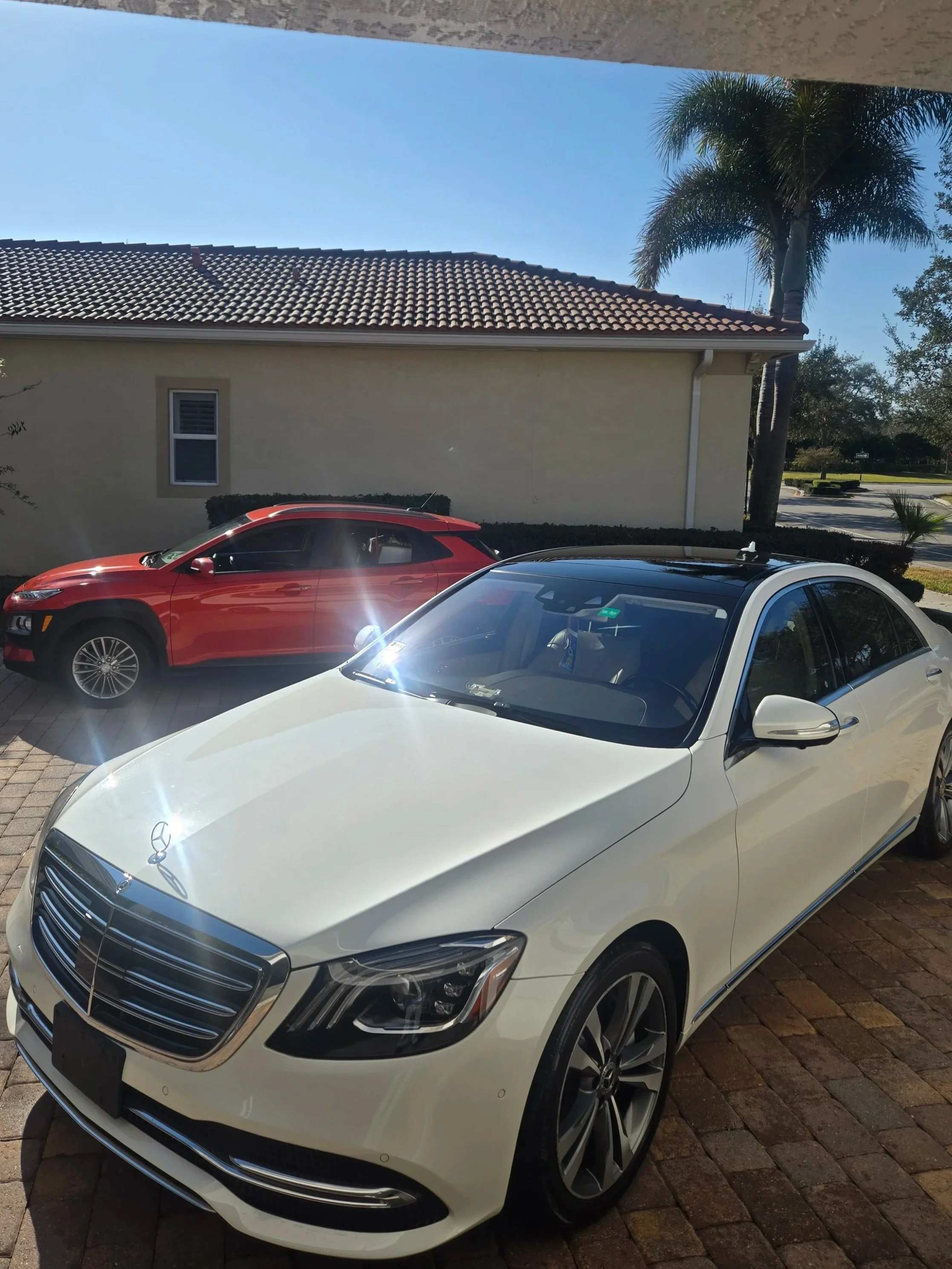 A white luxury Mercedes-Benz getting a signature Detail.