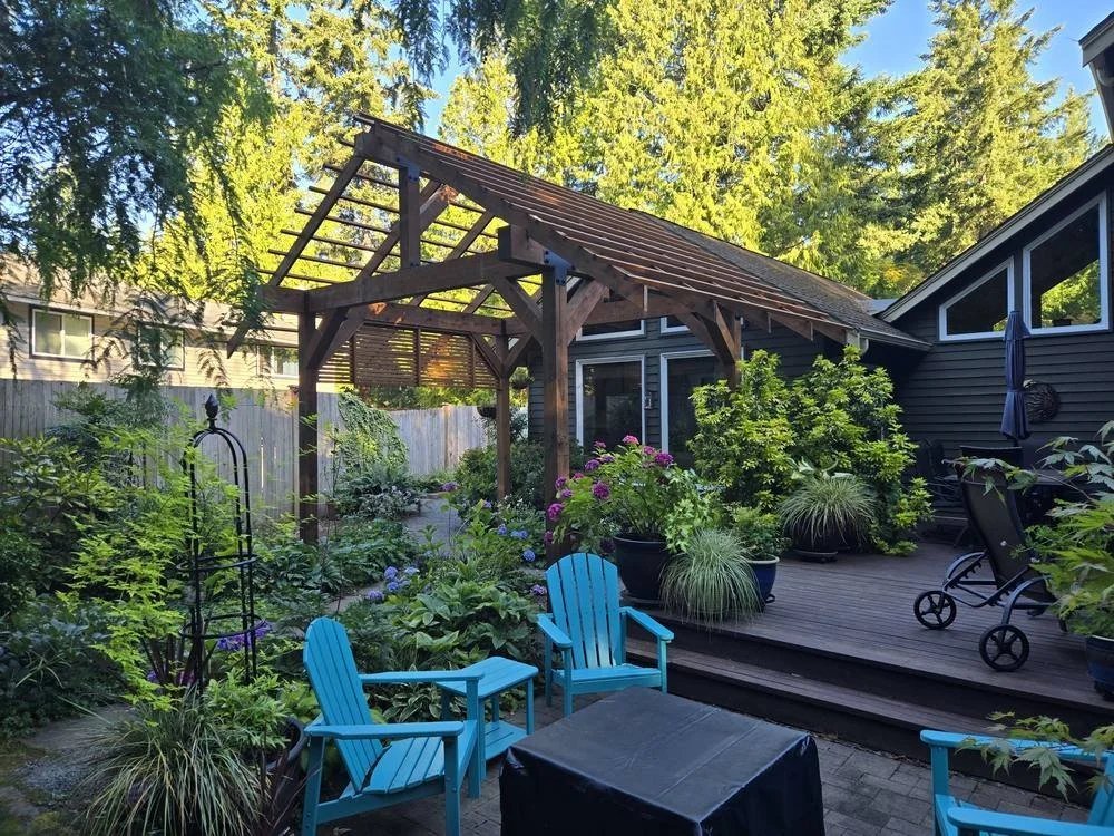 Timber frame pergola over a backyard patio in Edmonds, WA