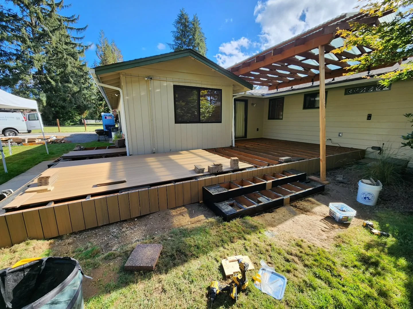 The deck cover almost done and skirting is going in!

TimberTech Coconut Husk is a super popular color this year!