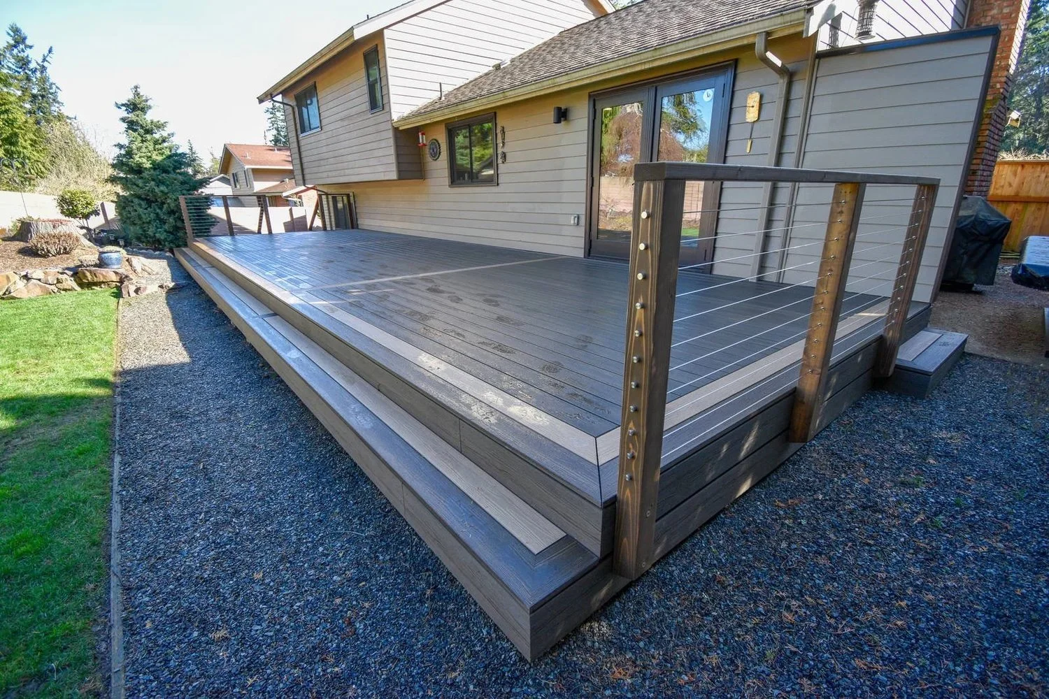 Replacement composite deck with wraparound steps in Mukilteo, WA