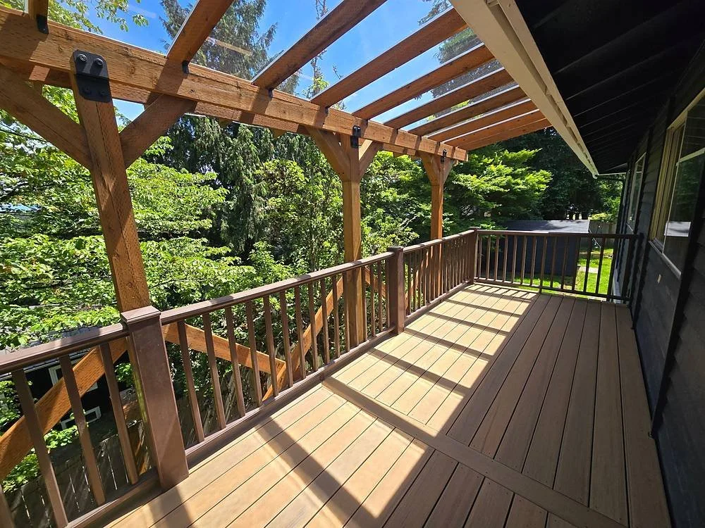 TimberTech Coconut Husk composite deck with timber patio cover posts and brown railing