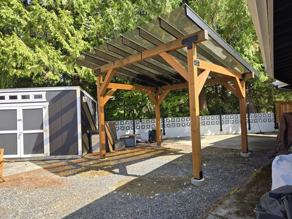 Timber patio cover with knee braces and black hardware, ready for a future hot tub