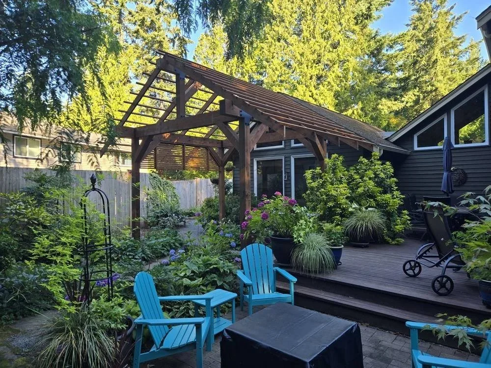 Timber frame pergola over a backyard patio in Edmonds, WA