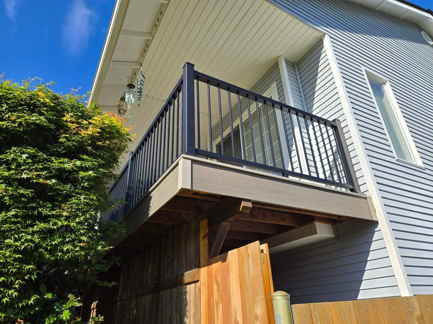 Side view of the rebuilt Lake Stevens front porch with aluminum railing