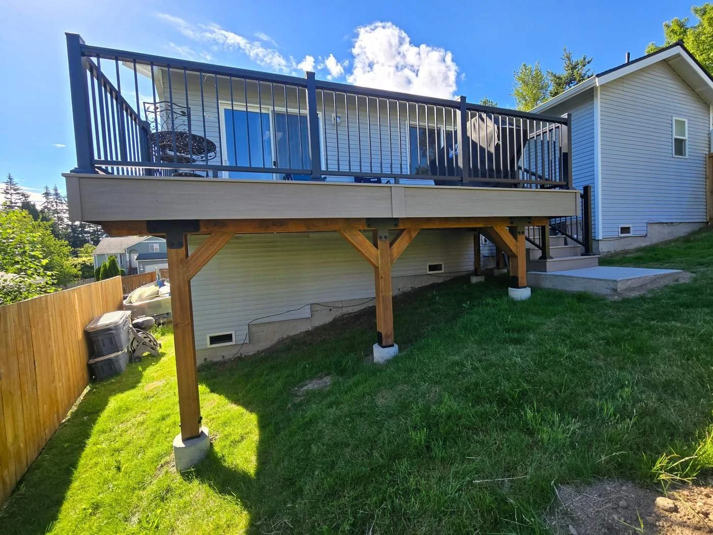 Rebuilt Lake Stevens back deck on timber posts with knee braces