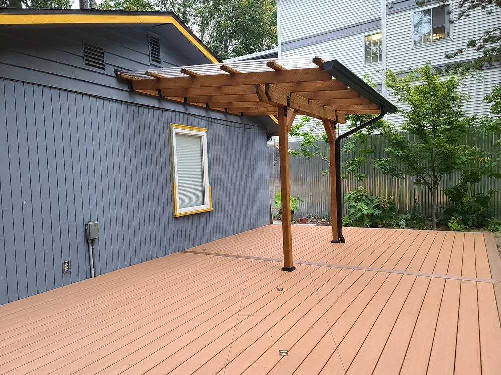 Small transparent patio cover over a PVC deck for enjoying the deck in the rain