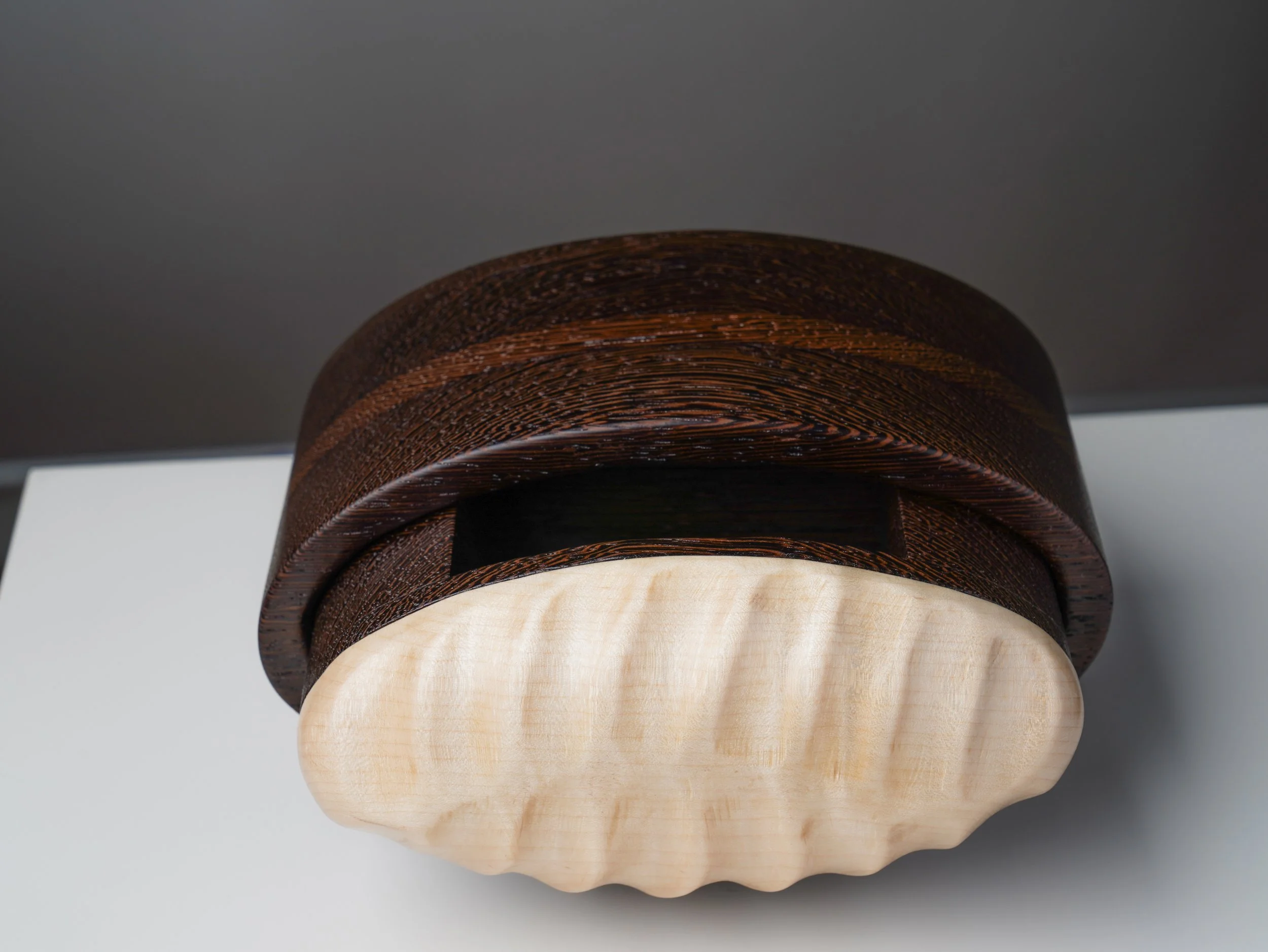 Wenge bandsaw box with its curly maple drawer partly pulled out.