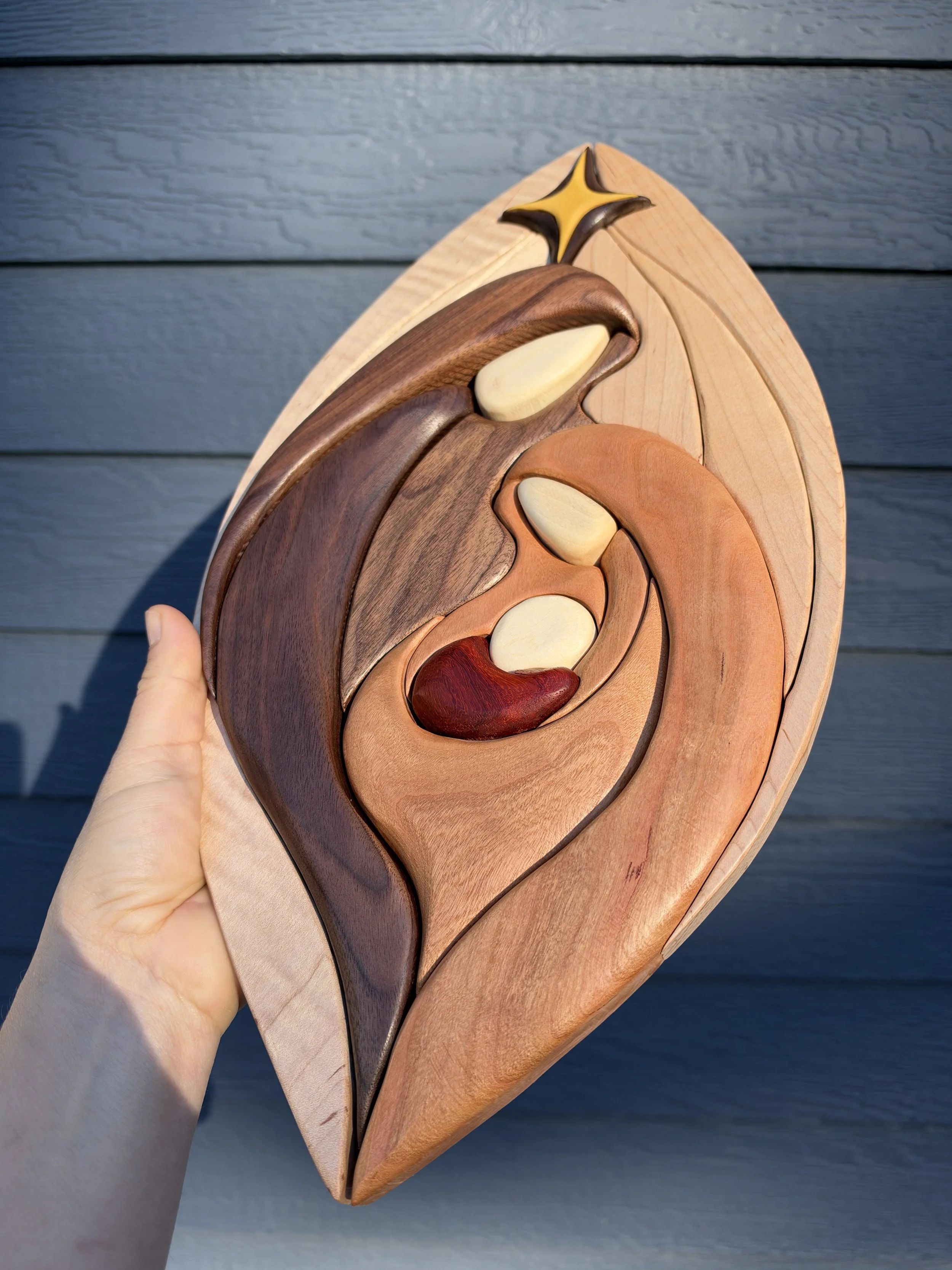 Detail of the natural wood colors in the intarsia nativity