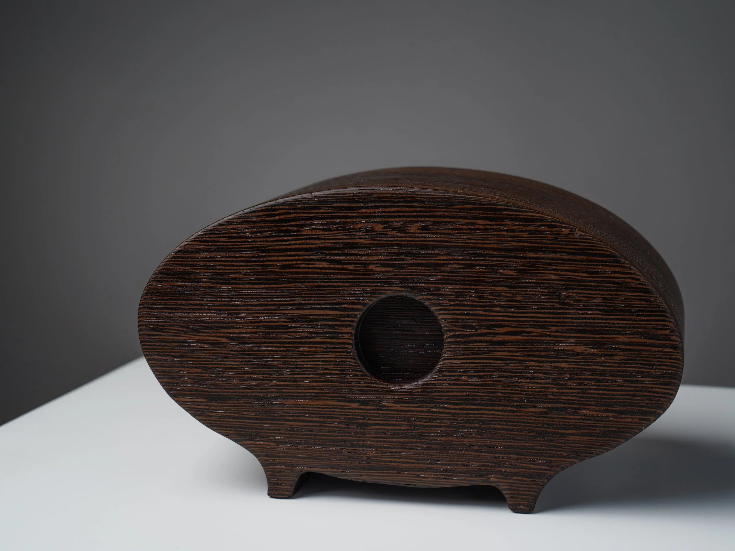 Back of the oval wenge bandsaw box showing a round opening.