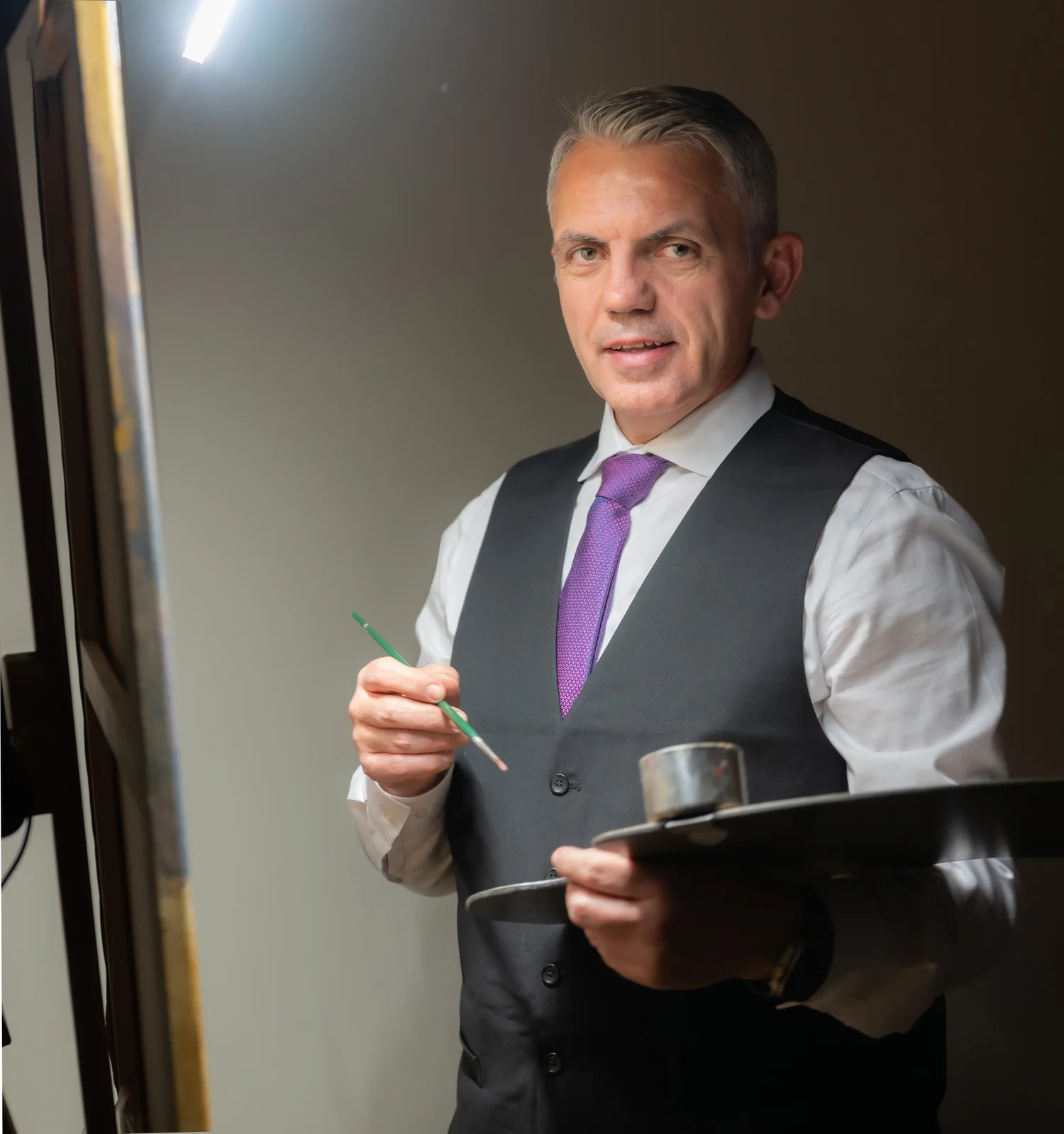 Flladi Kulla painting at the easel during a live wedding, fine art portrait artist working in New York, New Jersey, Pennsylvania, Connecticut, and Massachusetts